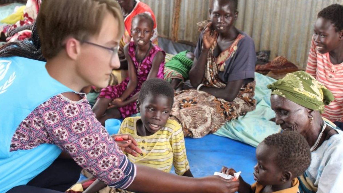 Stef feeding children in Africa